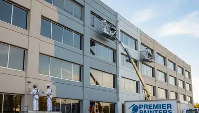 Professional commercial painters working on an office exterior in Escondido, CA