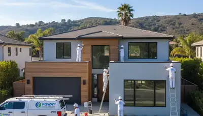 Professional house painters in Escondido, CA applying fresh exterior paint to residential home