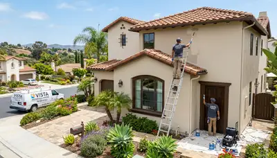 Professional house painter in Escondido CA applying exterior paint to home siding